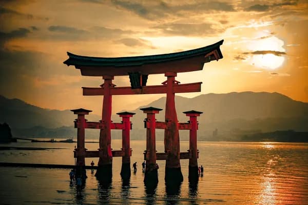 Floating torii gate at sunset